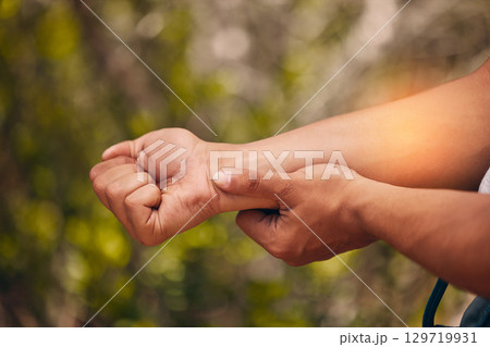Man, arm pain and abstract injury on sports workout, wellness exercise and health training in forest. Zoom on hands, fitness stress and medical emergency or burnout accident in nature hiking workout Man, arm pain and abstract injury on sports workout, wellness exercise and health training in forest. Zoom on hands, fitness stress and medical emergency or burnout accident in nature hiking workout 129719931