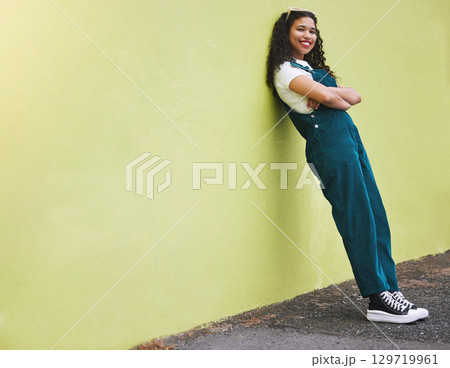 Colorful wall, mockup and fashion woman portrait in city with cool, trendy and happy attitude in urban town street. Young girl, urban student and gen z youth teenager standing outdoors with fun style 129719961
