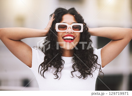 Happy fashion, city smile and model with sunglasses during summer, smile for designer clothes and excited about weekend in the urban town. Trendy, cool and smiling girl with confidence downtown Happy fashion, city smile and model with sunglasses during summer, smile for designer clothes and excited about weekend in the urban town. Trendy, cool and smiling girl with confidence downtown 129719971