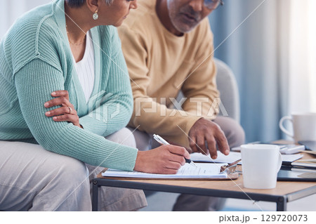 Senior couple, documents and sign contract for life insurance or home mortgage. Discussion, signature and retired elderly man and woman signing legal paperwork for will or loan application together. Senior couple, documents and sign contract for life insurance or home mortgage. Discussion, signature and retired elderly man and woman signing legal paperwork for will or loan application together. 129720073