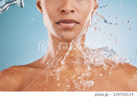 Water, cleaning and shower with a model black woman in studio on a blue background for hydration or hygiene. Relax, wellness and luxury with a water splash on a female in the bathroom for skincare Water, cleaning and shower with a model black woman in studio on a blue background for hydration or hygiene. Relax, wellness and luxury with a water splash on a female in the bathroom for skincare 129720114