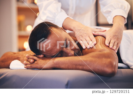 Spa, back massage and hands of therapist with oil for physical therapy, health and wellness on table. Patient man on table to relax, peace and luxury zen treatment at a beauty salon for stress relief 129720151