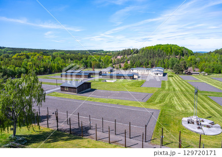 This memorial in Lesetice, Czechia, commemorates victims of communism at a former prison complex. Lush greenery surrounds the site, highlighting its somber history and significance. This memorial in Lesetice, Czechia, commemorates victims of communism at a former prison complex. Lush greenery surrounds the site, highlighting its somber history and significance. 129720171