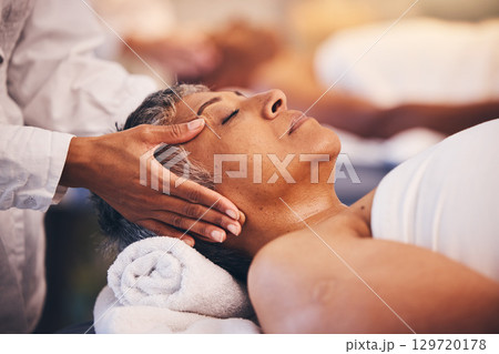 Face massage, relax and senior woman, spa wellness and sleeping during cosmetic therapy. Luxury hands, calm and masseuse with an elderly person at a hotel salon for care of body and sleep health 129720178
