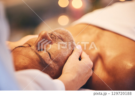 Spa, massage and face of a senior man on a table for health and wellness with physical therapy and skincare. Customer at beauty salon for facial, peace and zen treatment for healing and stress relief Spa, massage and face of a senior man on a table for health and wellness with physical therapy and skincare. Customer at beauty salon for facial, peace and zen treatment for healing and stress relief 129720188