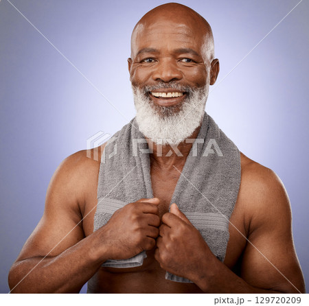 Man, mature and shower towel for skincare grooming, hygiene maintenance and cleaning on purple studio background. Portrait, smile and happy middle aged black model in healthcare wellness or self care 129720209