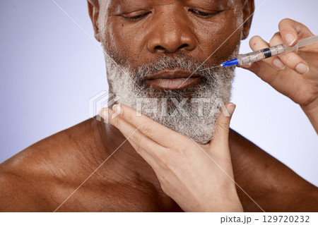 Senior man and needle for skincare, collagen injection and face lift on grey studio background. Plastic surgery, black male and relax for wellness, anti aging and toned skin for facial muscles Senior man and needle for skincare, collagen injection and face lift on grey studio background. Plastic surgery, black male and relax for wellness, anti aging and toned skin for facial muscles 129720232