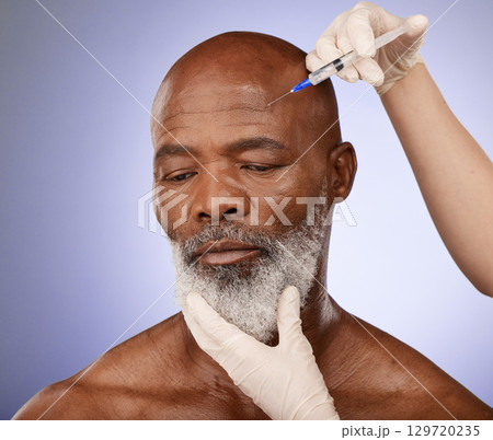 Face, senior black man and injection in studio isolated on a purple background. Retirement, plastic surgery or elderly male model with cosmetics or filler for skincare, beauty and wellness 129720235