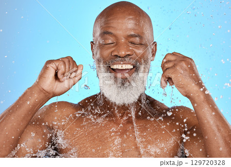 Senior black man, flossing teeth and dental cleaning, cosmetics care and mouth wellness in studio. African elderly person, tooth whitening and tooth wellness with dental floss against blue background Senior black man, flossing teeth and dental cleaning, cosmetics care and mouth wellness in studio. African elderly person, tooth whitening and tooth wellness with dental floss against blue background 129720328