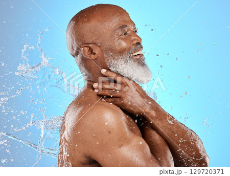 Beauty, skincare and splash with black man and water for shower, hydration and hygiene. Cleaning, fresh and grooming routine with senior model for self care, cosmetics and luxury in blue background 129720371