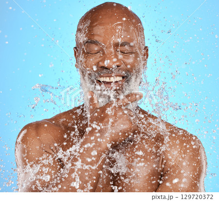 Senior man cleaning body with water for retirement self care, morning bathroom routine or skincare wellness treatment. Liquid splash, hygiene grooming and healthy clean face of elderly model washing 129720372
