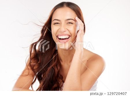 Portrait of woman, beauty and wind in studio for hair care, makeup and skincare in Colombia. Happy studio model, hair style and shine with motion, texture and aesthetic wellness from luxury shampoo 129720407