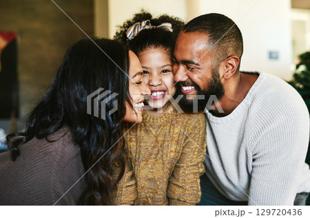 Black family, love and happiness portrait with a mother, father and child together with a smile, support and hug for gratitude. Man, woman and girl daughter bonding in the lounge while happy at home 129720436