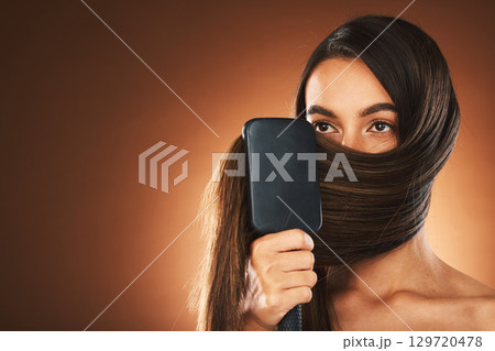 Hair care, salon and woman brushing hair, beauty glow and mockup space against brown studio background. Luxury shine, clean and model with a brush for hairdresser styling and advertising with mock up Hair care, salon and woman brushing hair, beauty glow and mockup space against brown studio background. Luxury shine, clean and model with a brush for hairdresser styling and advertising with mock up 129720478