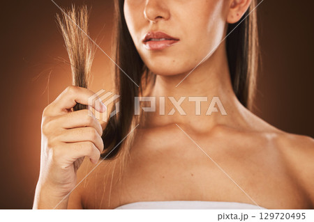 Hair problem, fail and woman stress with damaged hair, split ends or bad haircut. Trichology crisis, hair disaster and model unhappy with hair loss or damage from shampoo routine on studio background 129720495