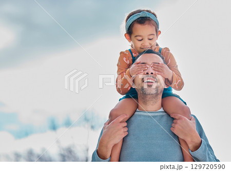 Father, child on shoulder and hands on eyes on nature walk for happy bonding, family time and relationship love. Dad, girl and kid daughter with a smile walking on outdoors mockup adventure together 129720590