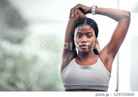 Black woman, arm or stretching in fitness, workout or training in muscle recovery, pain relief or healthcare wellness. Portrait, runner or sports athlete in warm up exercise or marathon running goals 129720692