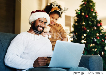 Father, girl and laptop with christmas ecommerce, credit card or online shopping with smile in home. Dad, daughter and shopping with computer for gift, present or giving in living room at family home 129720897