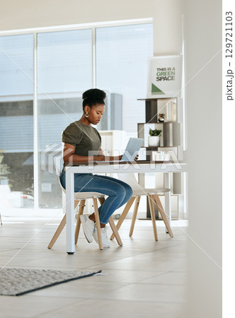 Black woman, laptop and working in home office for startup business entrepreneur, work from home expert or remote research manager. African girl, typing email or seo employee on computer at home 129721103