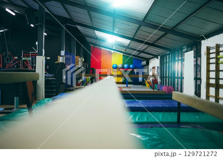 Balance beam, gymnastics fitness and training gym for gymnast performance in a sport club. No people, isolated and sports center for exercise, aerobics workout and arena competition practice 129721272