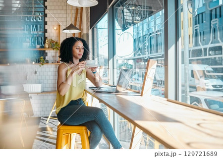 Coffee, tea and woman working in a cafe or Restaurant with laptop drinking espresso and planning. Freelancer, job and online or remote work for young female relax or break in the morning Coffee, tea and woman working in a cafe or Restaurant with laptop drinking espresso and planning. Freelancer, job and online or remote work for young female relax or break in the morning 129721689