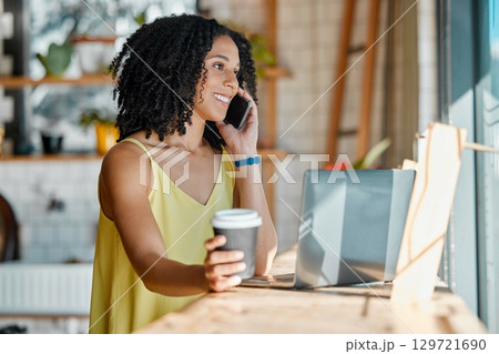 Black woman in cafe, phone call and remote work with laptop, freelance or influencer blog with networking. Connection, wifi and communication with tech, drink and relax in coffee shop with contact 129721690