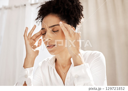 Headache, stress and black woman in home with pain feeling exhausted, burnout and anxiety. Depression, mental health problems and stressed female holding head from discomfort, migraine and frustrated 129721852