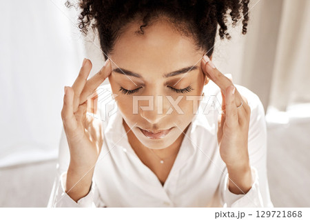 Black woman, headache and mental health stress, anxiety or frustrated at home. Stressed african person, overworked and remote working businesswoman with anger, head pain and tired of problems 129721868