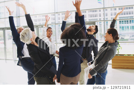 Success, celebration and excited business people in the office after project, deal or partnership. Collaboration, team building and corporate team with motivation, happiness and teamwork in workplace 129721911