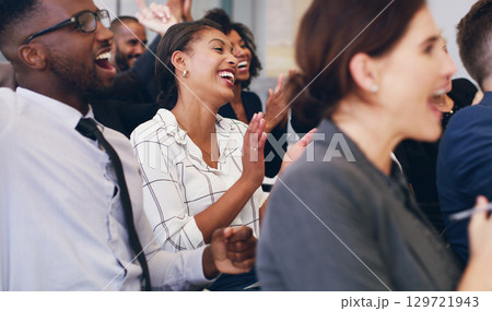 Applause, success and business people in conference, happy and support at a company event at work. Celebration, meeting and corporate crowd clapping in a training seminar for solidarity with a smile 129721943