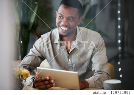 Black man, tablet and happy at coffee shop for social media marketing, communication app or web. Man, cafe and mobile technology for social network, planning schedule or internet research at table 129721992