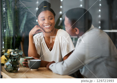 Love, black couple and talking at cafe with coffee on romantic date. Coffee shop, communication and romance of man and woman speaking, discussion and having a conversation while drinking espresso. 129721993