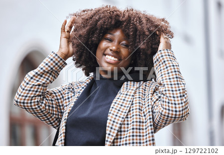 Black woman, portrait and afro hair in city fun, goofy or silly travel in urban New York or holiday location. Smile, happy or playful student in fashion, trendy or cool clothes with natural hairstyle 129722102