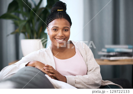 Black woman, smile and portrait on sofa in home with happiness, self love and relax in living room. Happy, African woman and student on lounge couch in house, flat or apartment to rest in free time 129722133