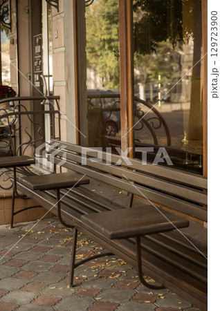 tables and benches near a street cafe tables and benches near a street cafe 129723900