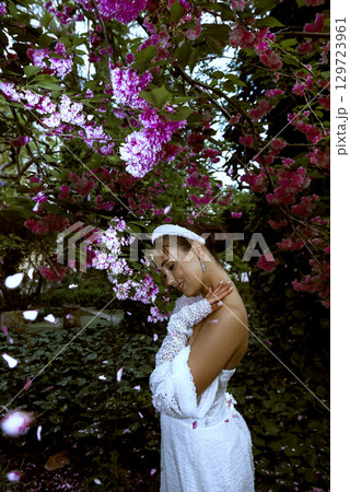 very beautiful girl among blooming sakura 129723961