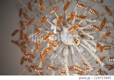 crystal chandelier on the ceiling close-up crystal chandelier on the ceiling close-up 129723995