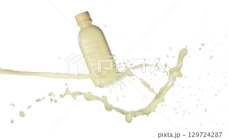 Tofu Soybean soymilk pour fall down in bottle container. Soybean milk or cosmetic cream moisturizer spill splash as paint color. White background isolated high speed shutter freeze motion 129724287