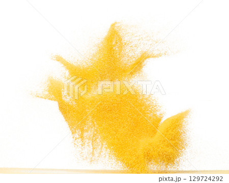 Small size yellow Sand flying explosion, gold cheese sands grain wave explode. Abstract cloud fly. Yellow colored sand splash throwing in Air. White background Isolated high speed shutter, throwing Small size yellow Sand flying explosion, gold cheese sands grain wave explode. Abstract cloud fly. Yellow colored sand splash throwing in Air. White background Isolated high speed shutter, throwing 129724292