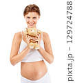 Pregnancy portrait, woman and teddy bear of a mother happy about pregnant stomach and baby toy. Excited, love and mama smile with children doll ready for motherhood, family and loving parent care 129724788