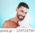 Shower, towel and man cleaning face during morning dermatology treatment, luxury bathroom routine or beauty self care. Spa salon, wellness and model with skincare glow, facial healthcare and hygiene 129724790