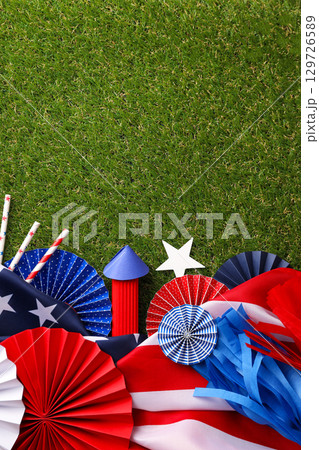Festive Labor Day decorations in patriotic colors on grass 129726589