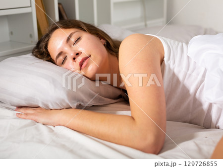 Cute young seductive girl in pajama sleeping in bed Cute young seductive girl in pajama sleeping in bed 129726855
