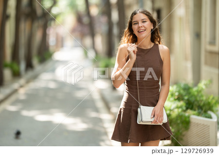 Woman walking in the park in summer Woman walking in the park in summer 129726939