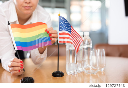 Flags of United States and LGBT on negotiating table 129727548