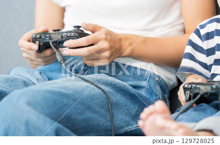 Family Gaming Time: Mother and Child Playing Video Games Family Gaming Time: Mother and Child Playing Video Games 129728025
