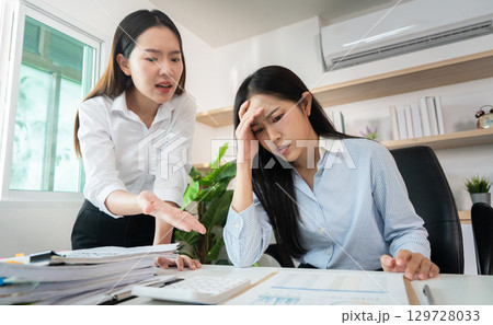 Workplace Tension. Employee feeling overwhelmed during a critical performance review. Workplace Tension. Employee feeling overwhelmed during a critical performance review. 129728033