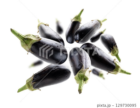Ripe eggplants levitate on a white background 129730095