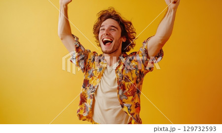 happy man celebrating success with arms raised 129732593