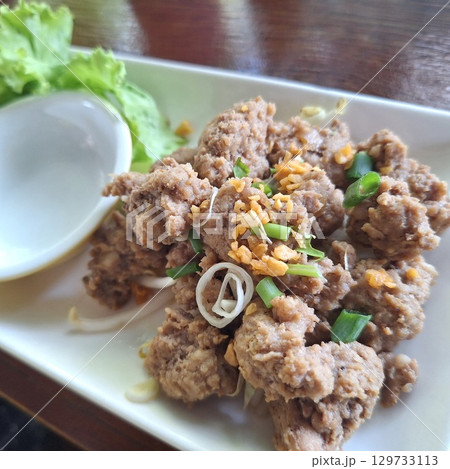 Savory Thai minced pork dish with garlic and herbs Savory Thai minced pork dish with garlic and herbs 129733113